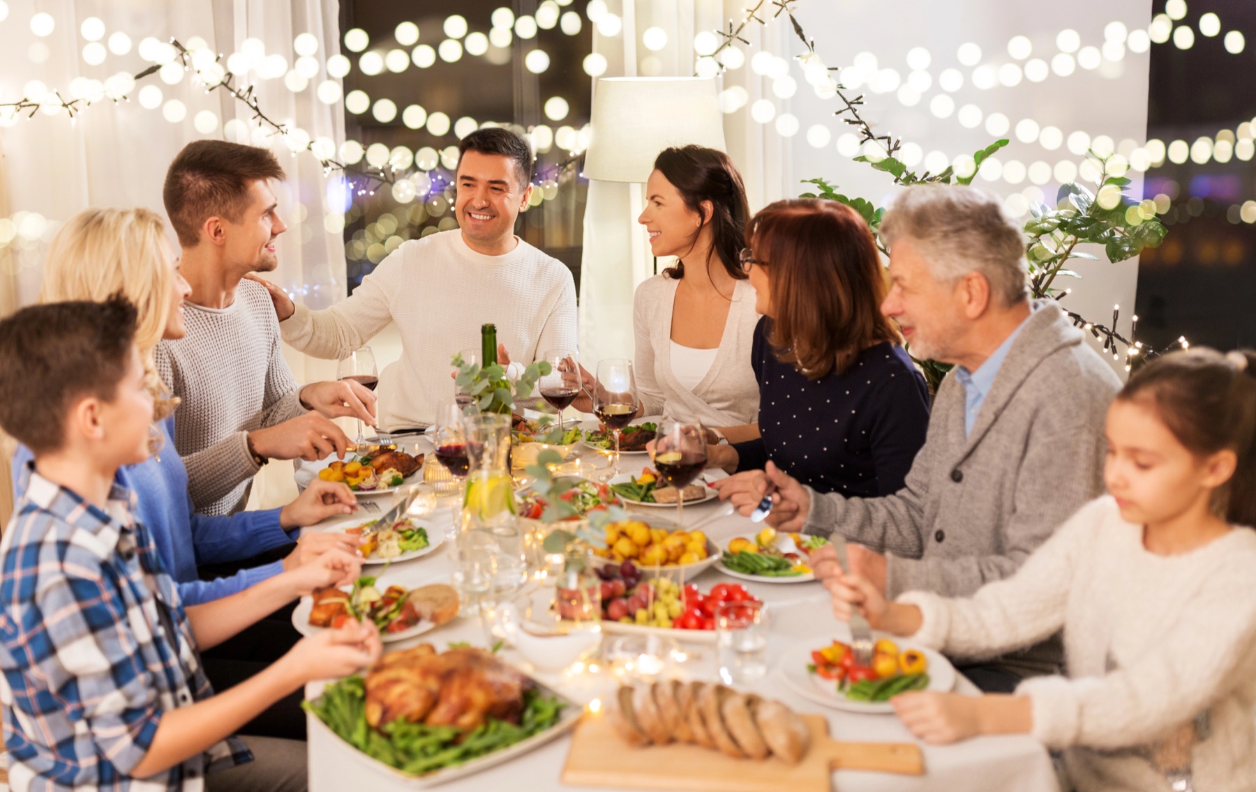 A family of three generations sharing a meal around a table